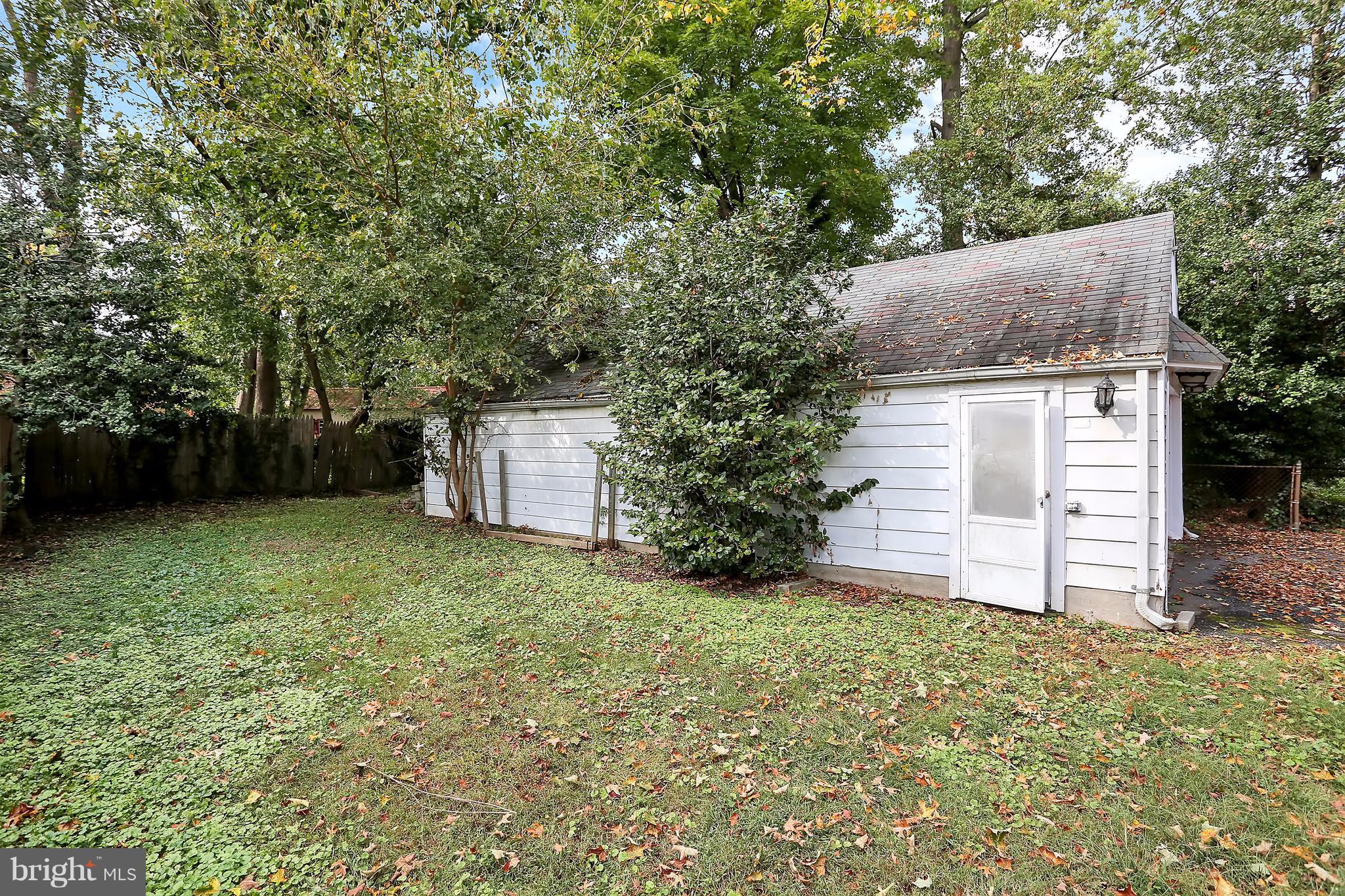 9408 Flower Avenue Silver Spring, MD 20901 - Photo 28 of 29 Side view of the garage and backyard