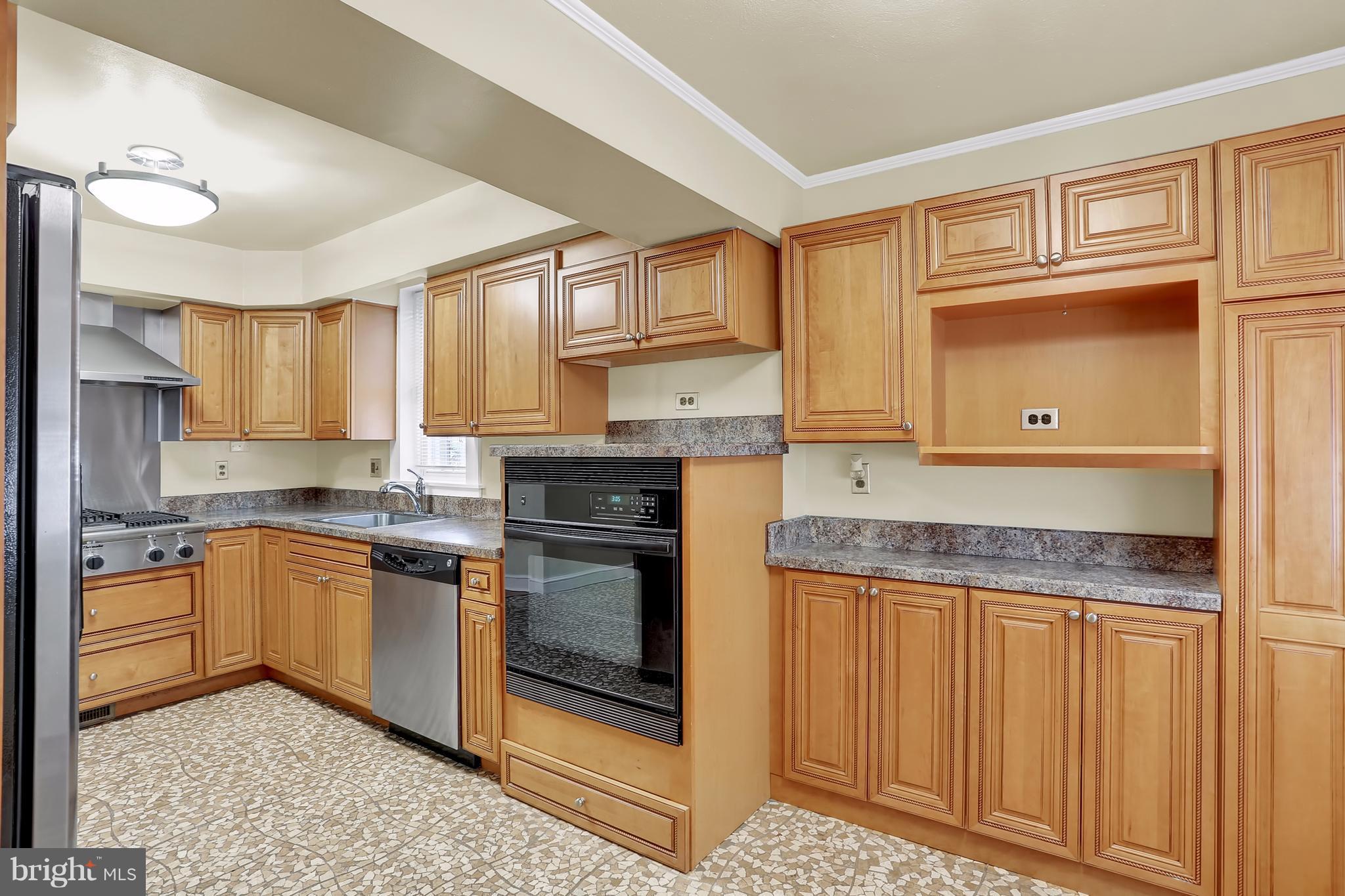 9408 Flower Avenue Silver Spring, MD 20901 - Photo 10 of 29 Plenty of cabinet storage and countertop workspace