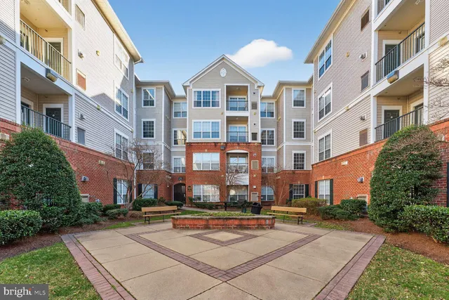 a view of a building with a yard