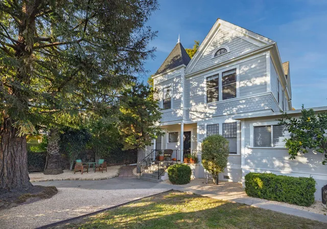 a view of a house with backyard porch and sitting area