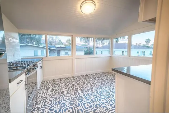 a view of a livingroom with wooden floor and a window