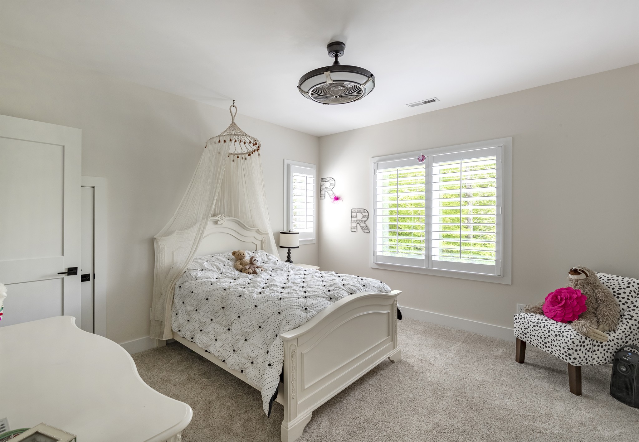 5304 Old Harding Road Franklin, TN 37064 - Photo 15 of 29 a bedroom with a bed and a chandelier