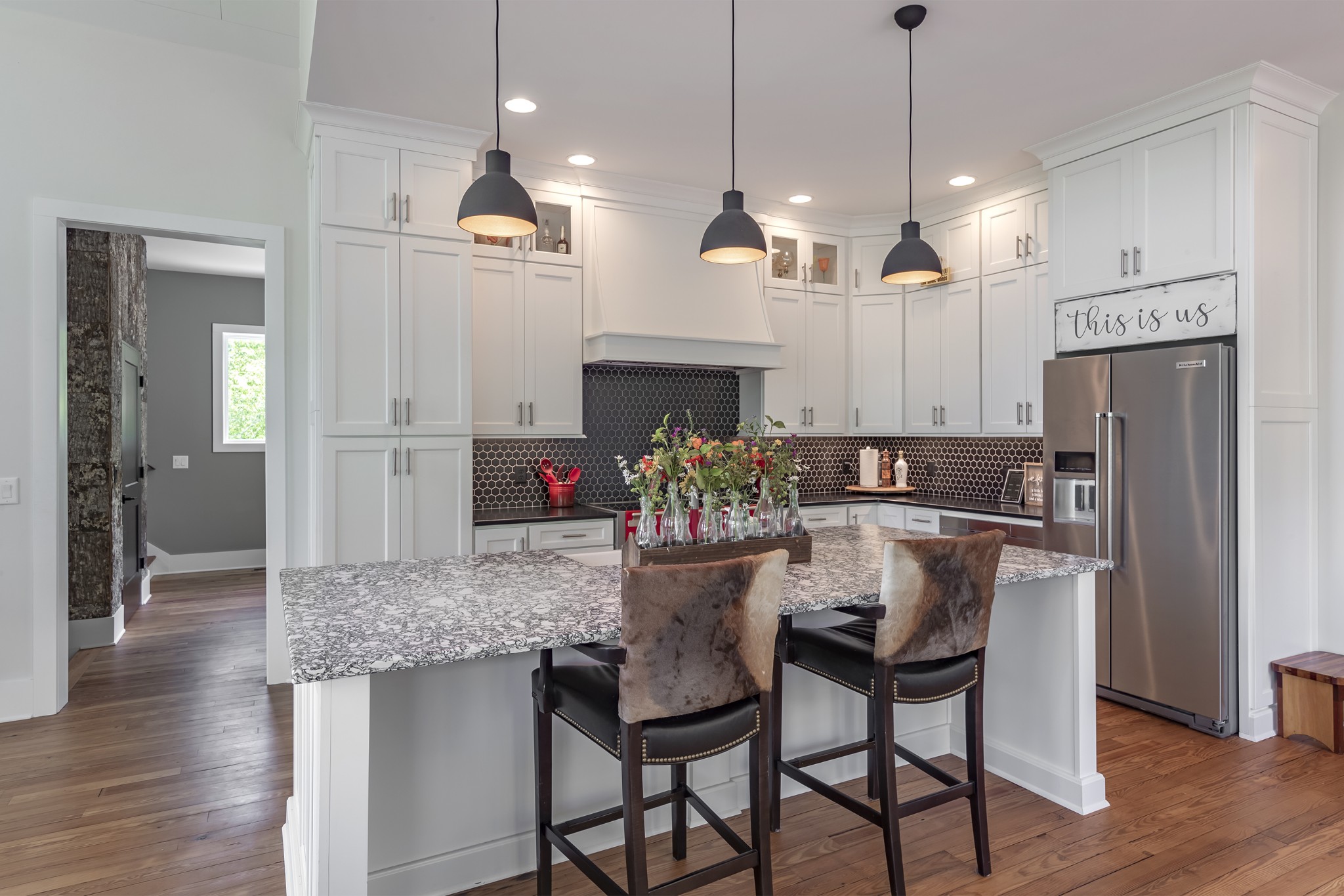 5304 Old Harding Road Franklin, TN 37064 - Photo 9 of 29 a kitchen with kitchen island a dining table chairs stainless steel appliances and cabinets