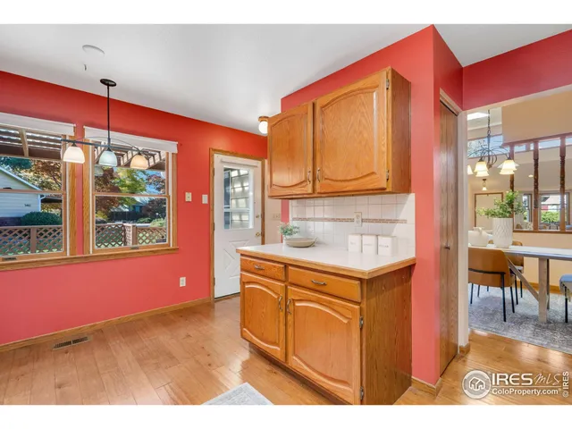 a kitchen that has a cabinets window and chairs