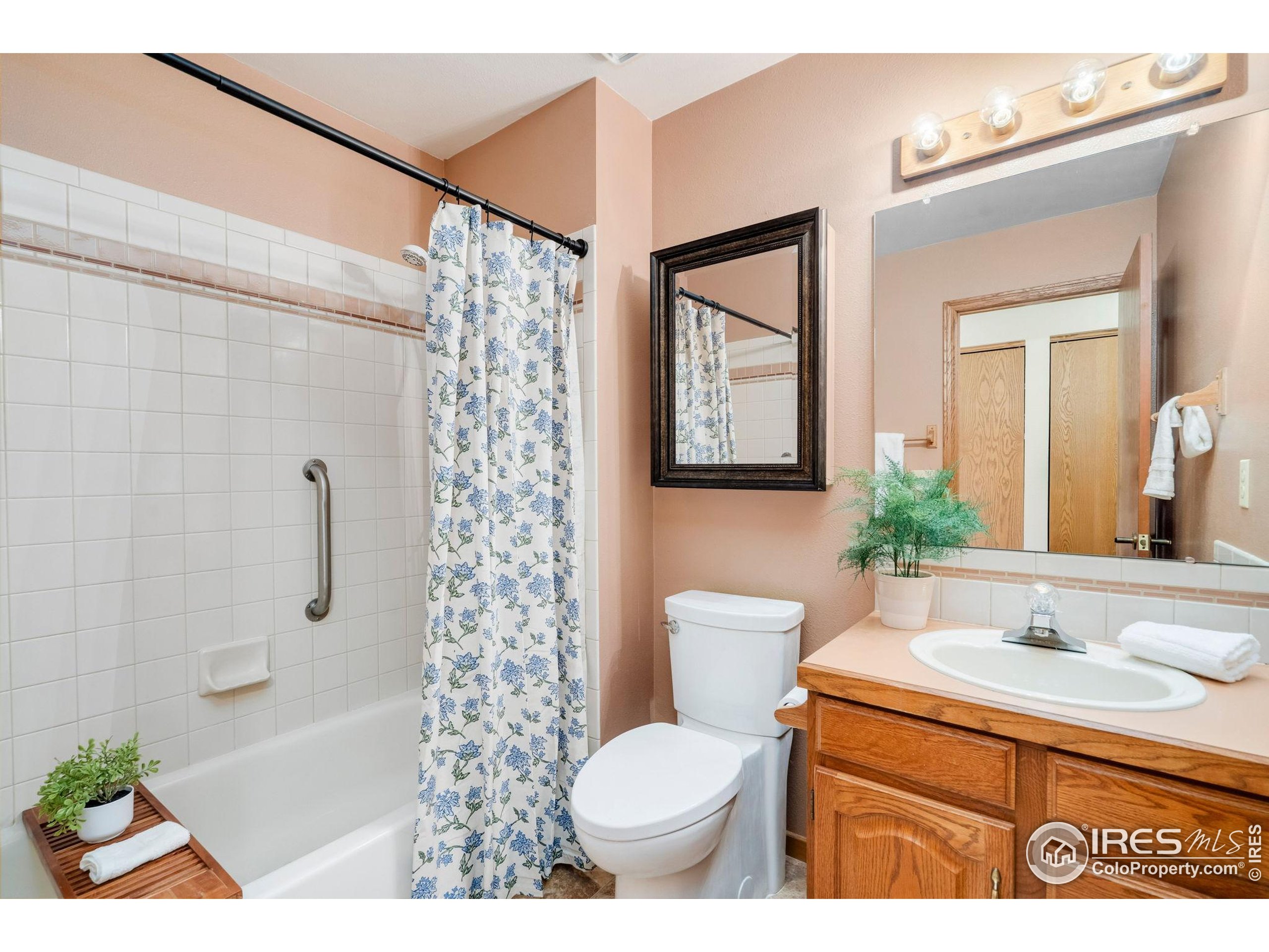 3344 Hickok Drive, Unit F Fort Collins, CO 80526 - Photo 17 of 24 a bathroom with a sink toilet and shower