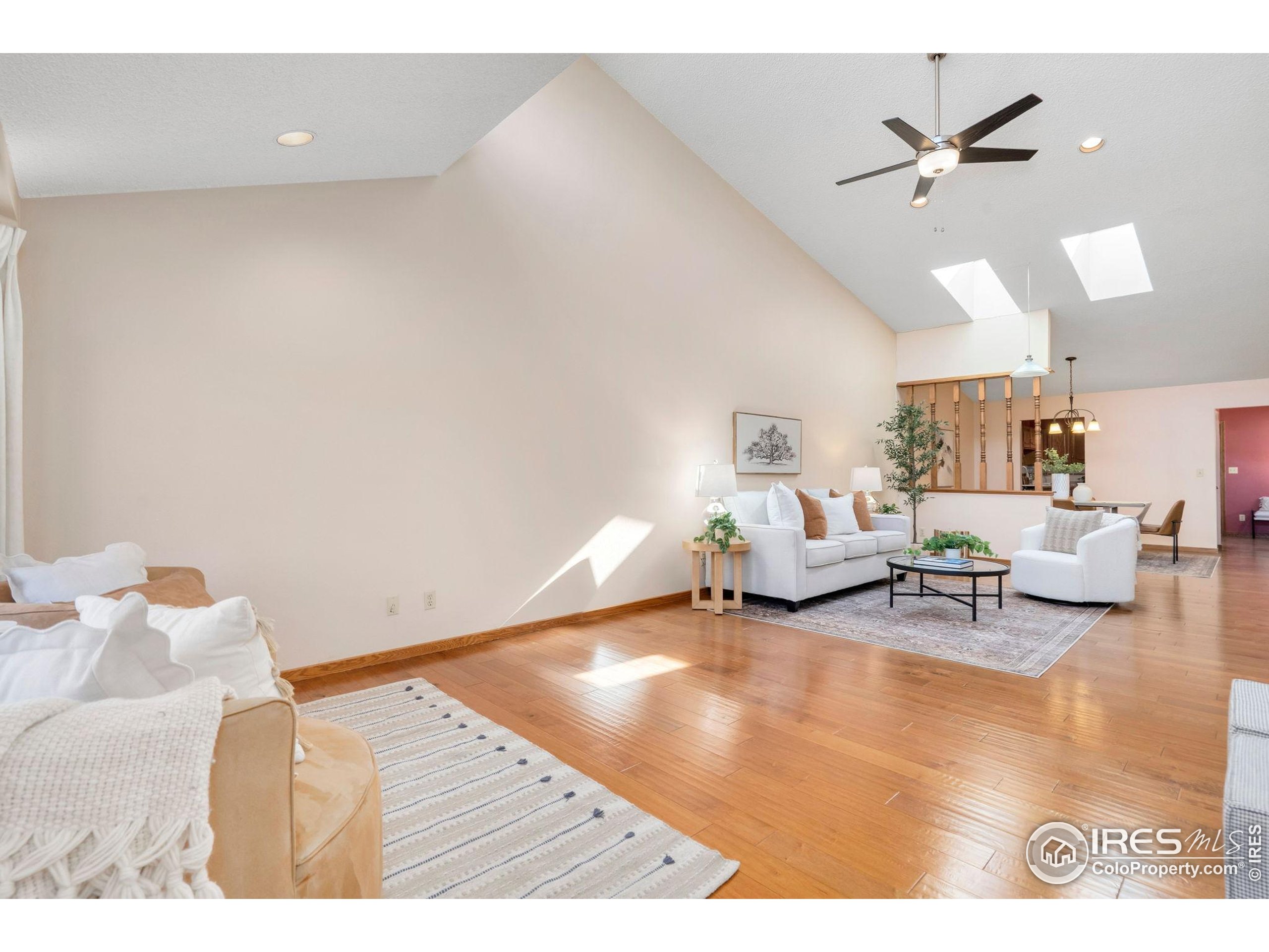 3344 Hickok Drive, Unit F Fort Collins, CO 80526 - Photo 3 of 24 a living room with furniture and a ceiling fan