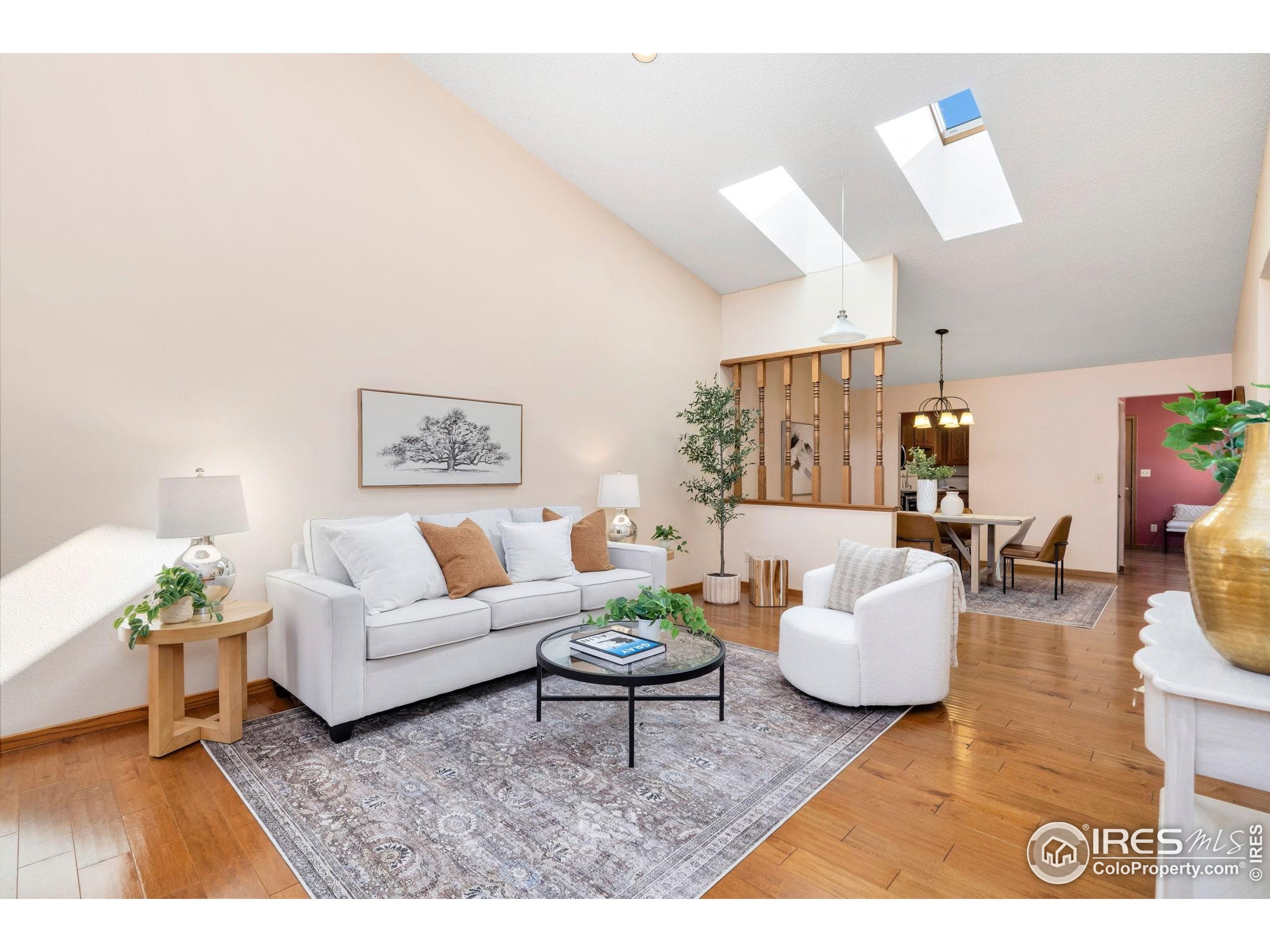 3344 Hickok Drive, Unit F Fort Collins, CO 80526 - Photo 6 of 24 a living room with furniture and a wooden floor