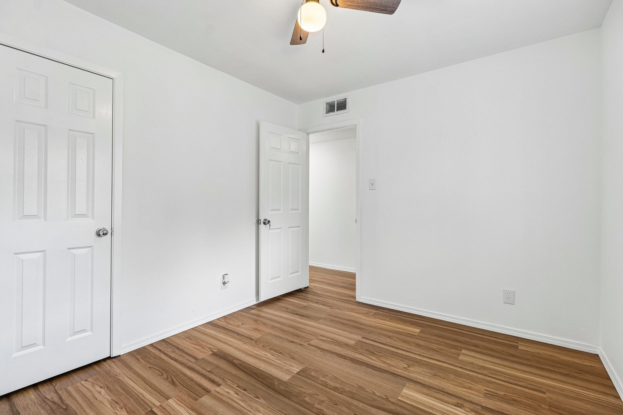 5809 Coventry Lane Austin, TX 78723 - Photo 20 of 35 Upstairs beedroom with wood plank flooring