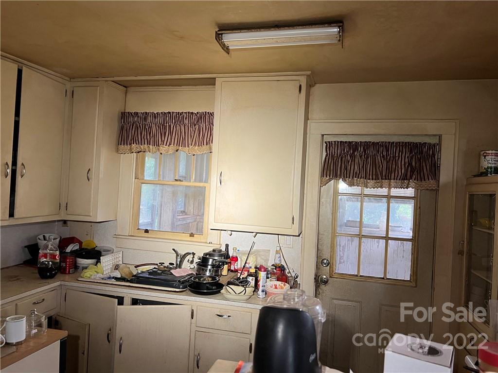 6319 Tuckaseegee Road Charlotte, NC 28208 - Photo 11 of 16 a view of a kitchen with a sink and cabinets