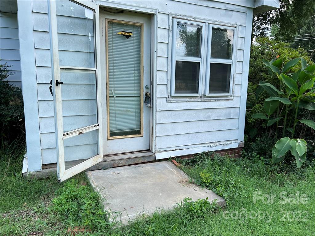 6319 Tuckaseegee Road Charlotte, NC 28208 - Photo 6 of 16 a view of front door and yard