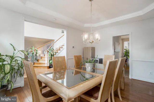 a view of entryway with wooden floor and stairs