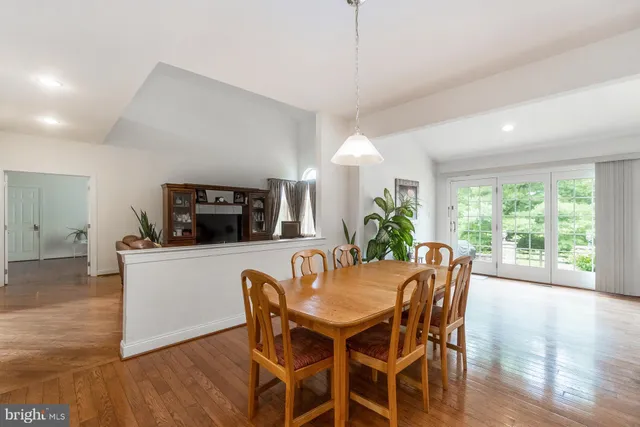 a kitchen with granite countertop a sink a stove and cabinets