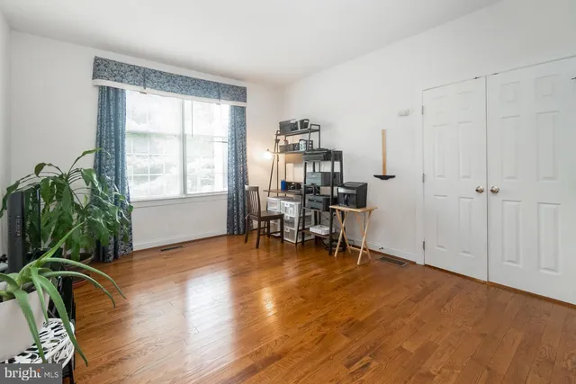 a bedroom with a bed and dresser
