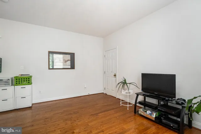 a bathroom with a toilet a sink and a mirror