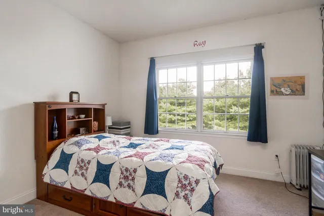 a view of a yard with a house in the background