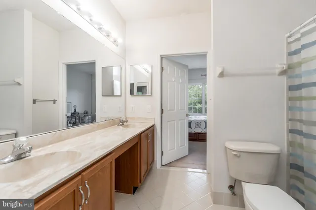 an aerial view of a house with a yard and garden