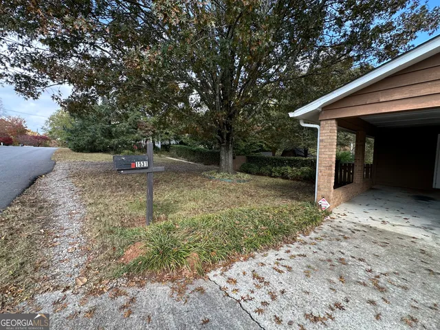 a house with trees in front of it