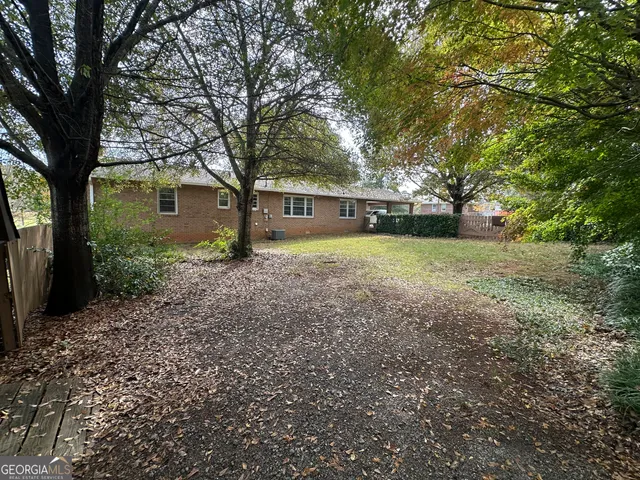 a backyard of a house with lots of green space