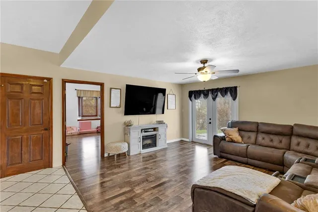 a living room with furniture and a flat screen tv