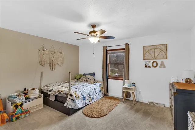a bedroom with furniture and a chandelier