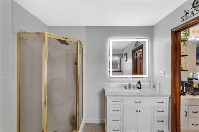 a bathroom with a double vanity sink mirror and double