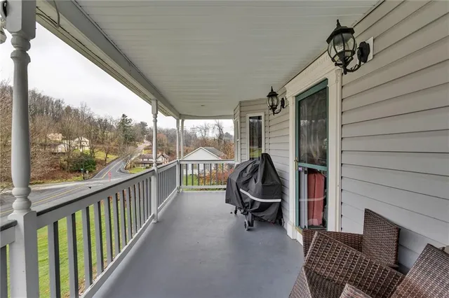 a view of a livingroom with furniture and a window