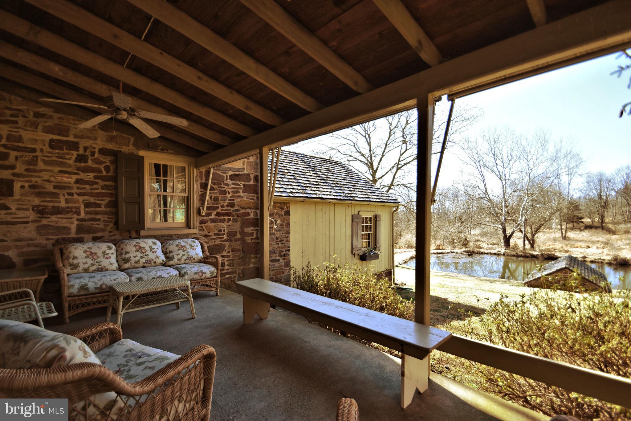 554 Mud Road Newtown, PA 18940 - Photo 35 of 46 West Porch overlooks Pond and Pool