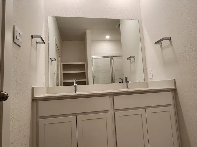 a kitchen with microwave a stove and cabinets