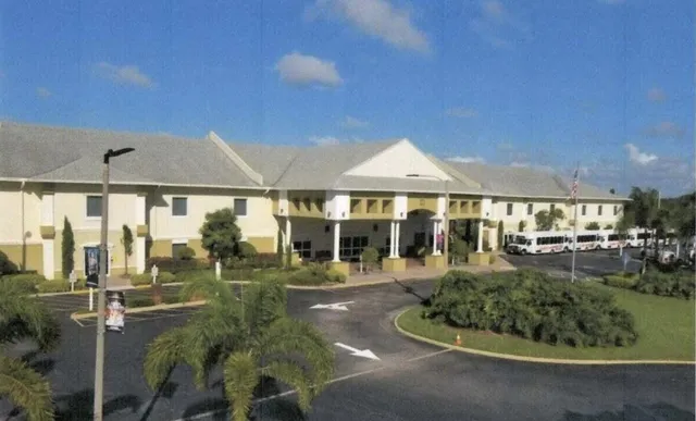 a view of a house with backyard porch and sitting area