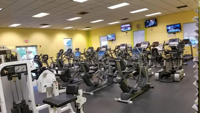 a view of a swimming pool with outdoor seating and plants