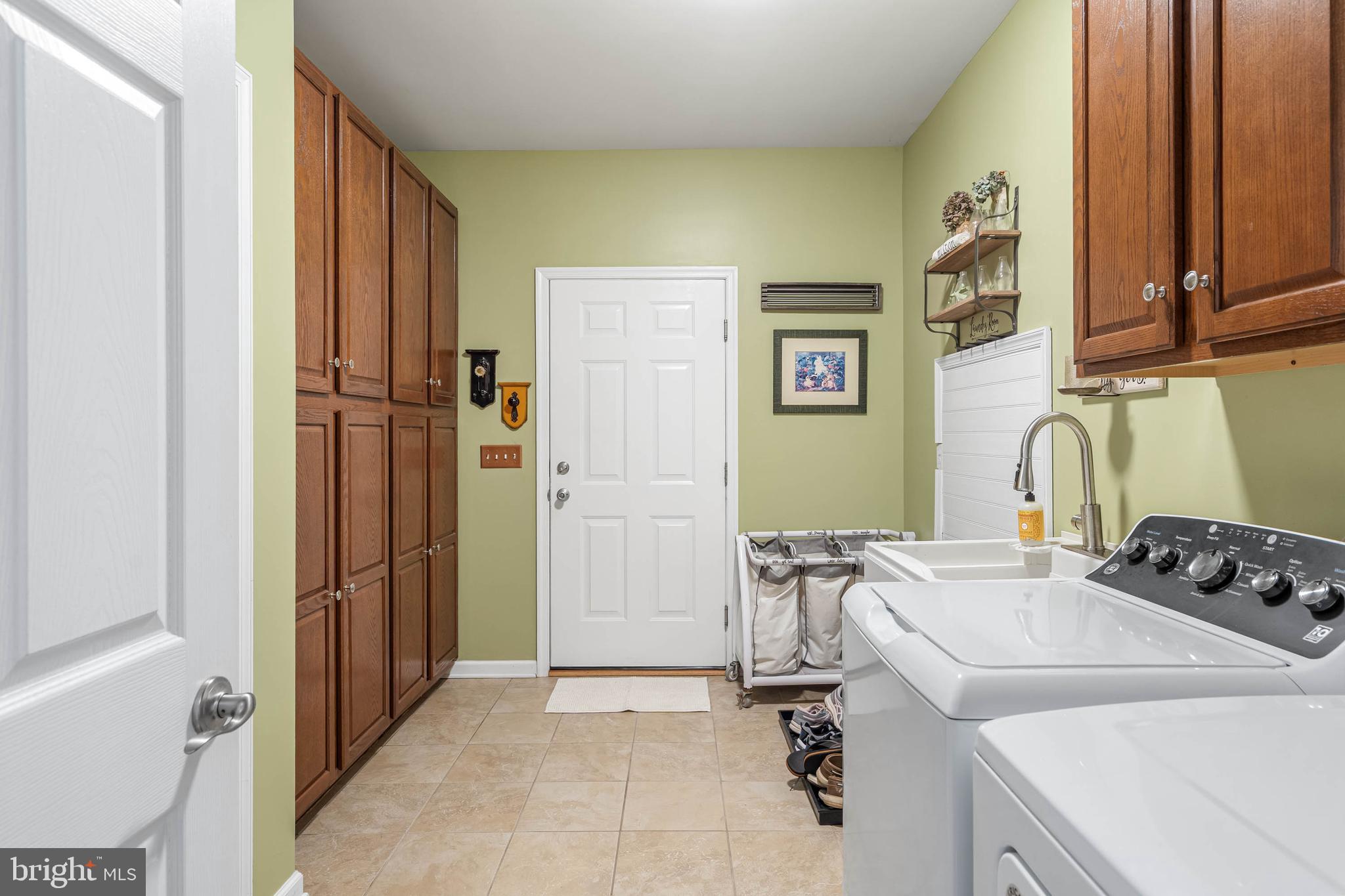 21062 Cool Spring Road Milton, DE 19968 - Photo 22 of 44 a room with a sink and a refrigerator