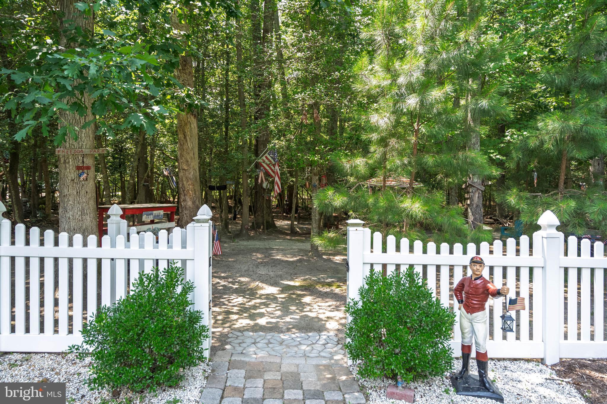 21062 Cool Spring Road Milton, DE 19968 - Photo 35 of 44 a view of a bench in a garden