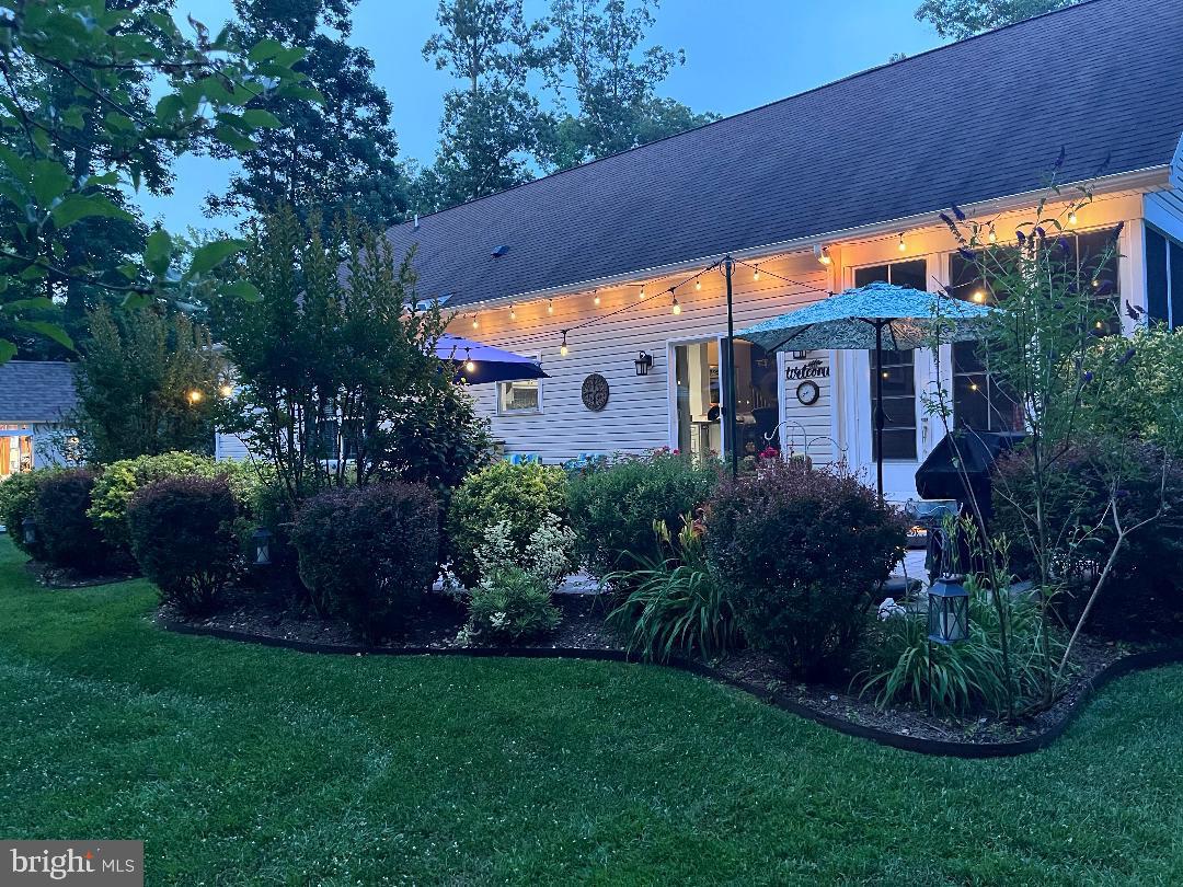 21062 Cool Spring Road Milton, DE 19968 - Photo 41 of 44 a front view of house with a garden
