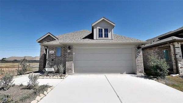 a front view of a house with a garage