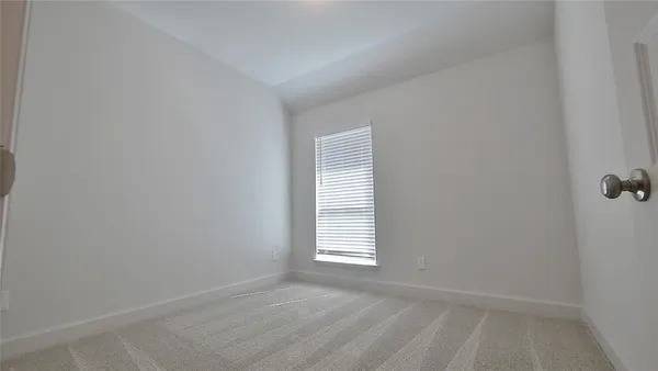a view of a room that has a window in it
