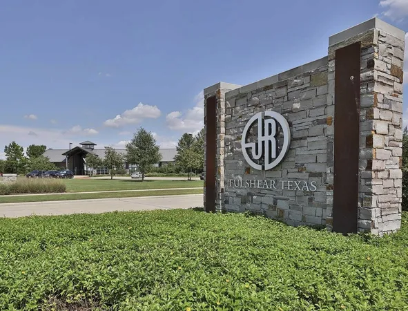 an aerial view of a house with swimming pool and outdoor seating