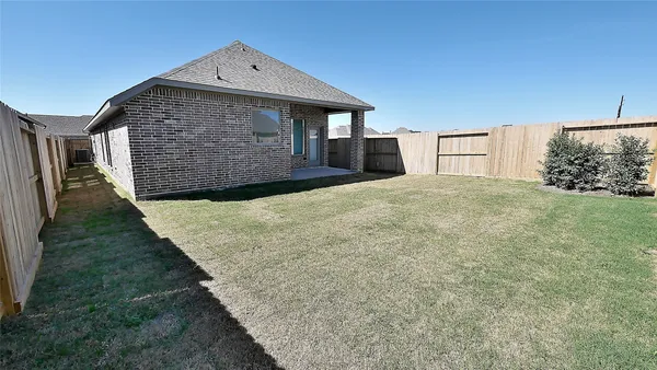 a view of a backyard of the house
