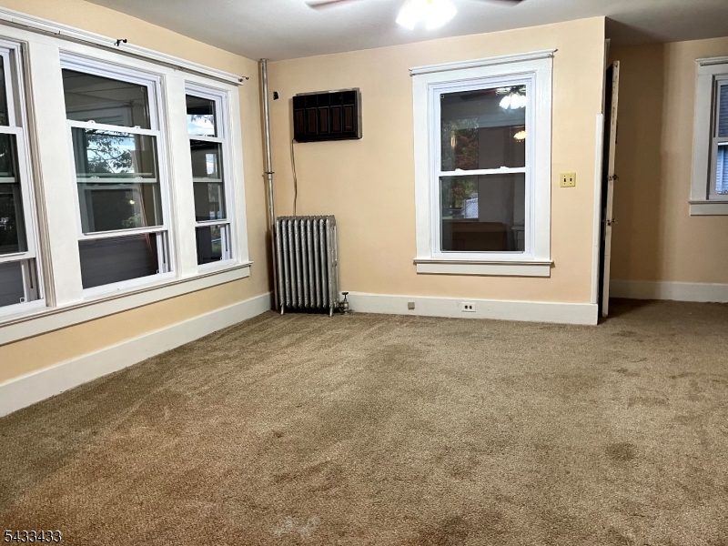 30 Fowler Street Franklin, NJ 07416 - Photo 15 of 27 a view of an empty room with a window and kitchen area
