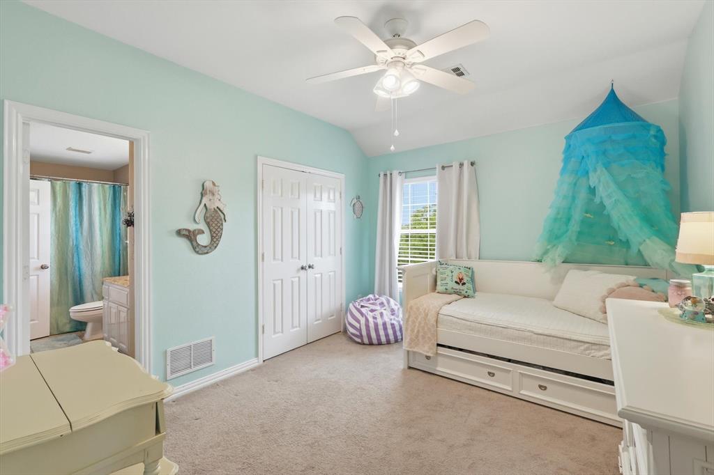 216 Durango Drive Trophy Club, TX 76262 - Photo 26 of 40 This room features light blue walls, a ceiling fan, and carpeted flooring