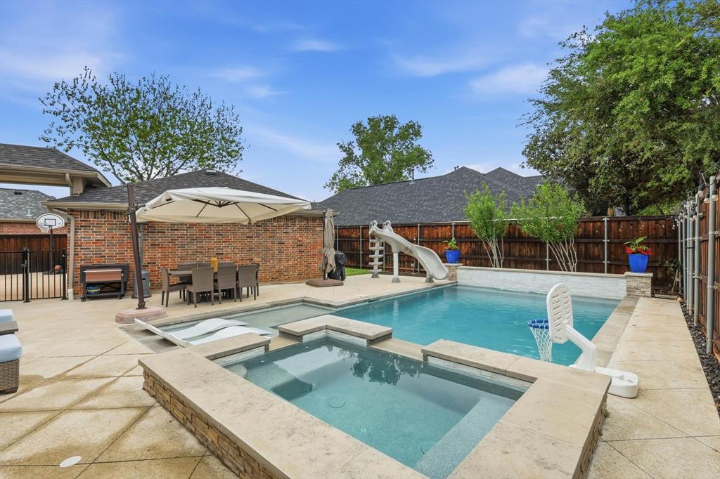 216 Durango Drive Trophy Club, TX 76262 - Photo 30 of 40 The property features a backyard with a swimming pool, an integrated spa, and a concrete patio