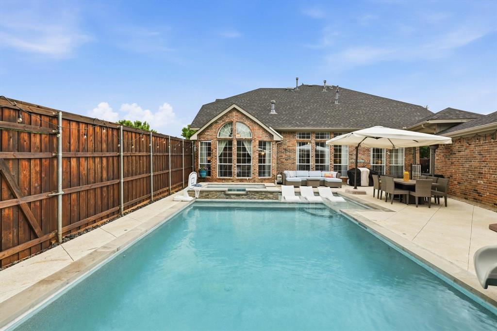 216 Durango Drive Trophy Club, TX 76262 - Photo 33 of 40 The property features a private backyard with a swimming pool, a hot tub, and a spacious patio area
