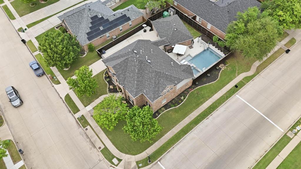 216 Durango Drive Trophy Club, TX 76262 - Photo 37 of 40 This property features a well-maintained exterior with a dark-tiled roof and brick siding