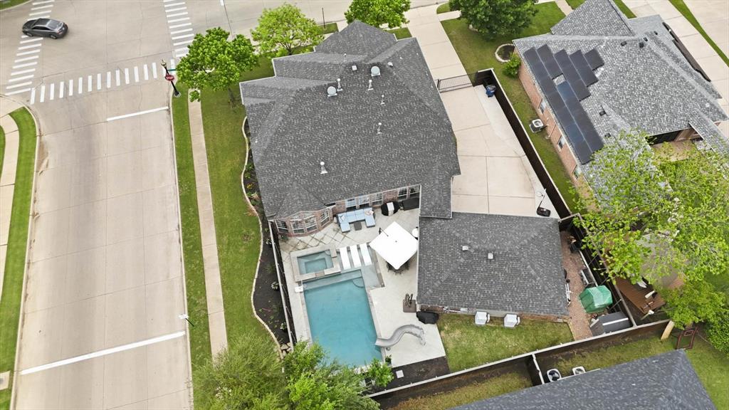 216 Durango Drive Trophy Club, TX 76262 - Photo 38 of 40 Aerial view of the property showing a private swimming pool, an attached spa, and a spacious patio area