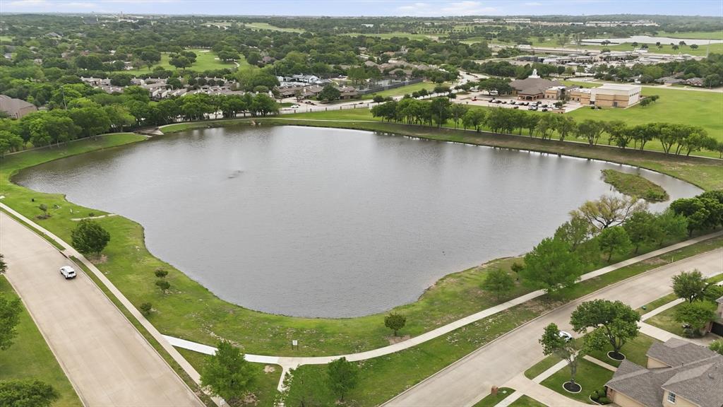 216 Durango Drive Trophy Club, TX 76262 - Photo 40 of 40 This property offers a scenic view of a substantial lake, bordered by a green lawn and trees