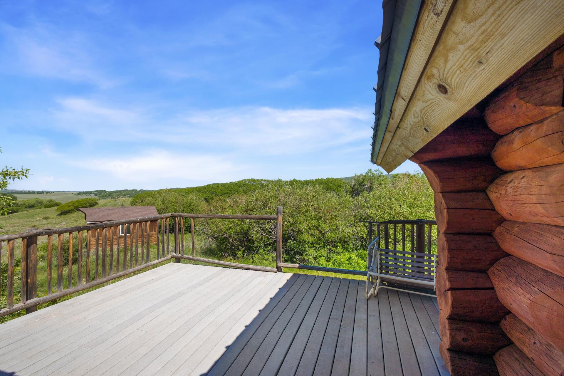 13984 Last Dollar Road Placerville, CO 81430 - Photo 26 of 43 a view of balcony with wooden floor and fence