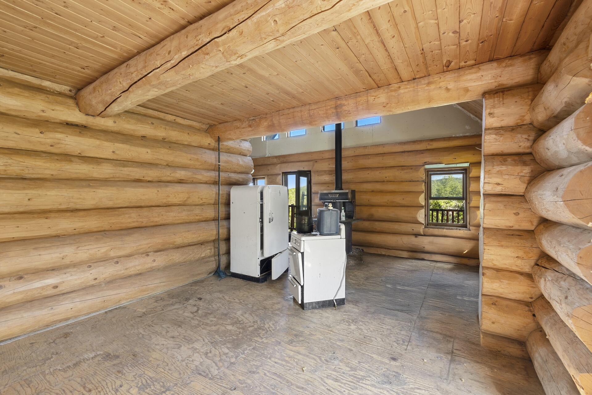 13984 Last Dollar Road Placerville, CO 81430 - Photo 9 of 43 a view of a room with racks on the wall
