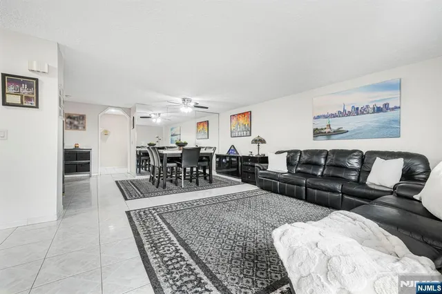 a living room with furniture and a table