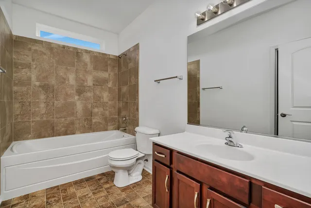 a bathroom with a sink a toilet and a bathtub