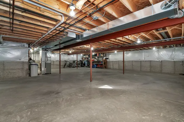 a view of empty room with wooden ceiling