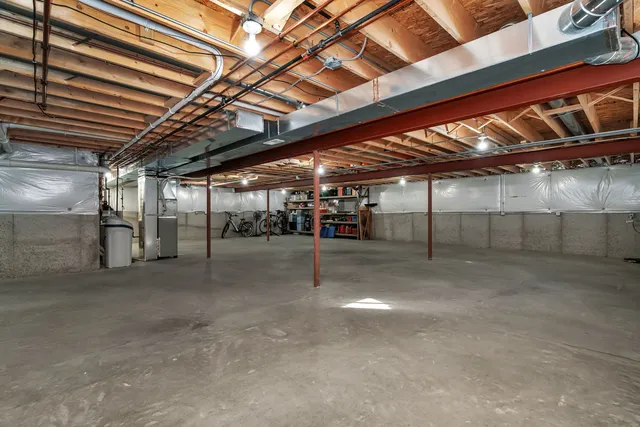 a view of empty room with wooden ceiling